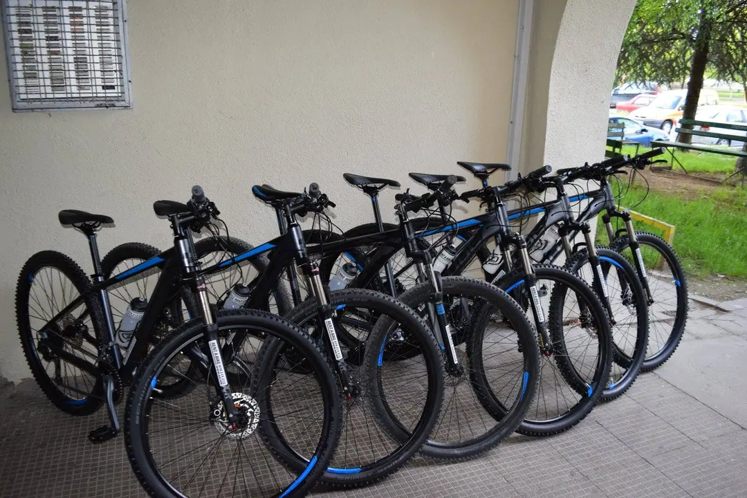 Row of black CUBE mountain bikes ready to rent
