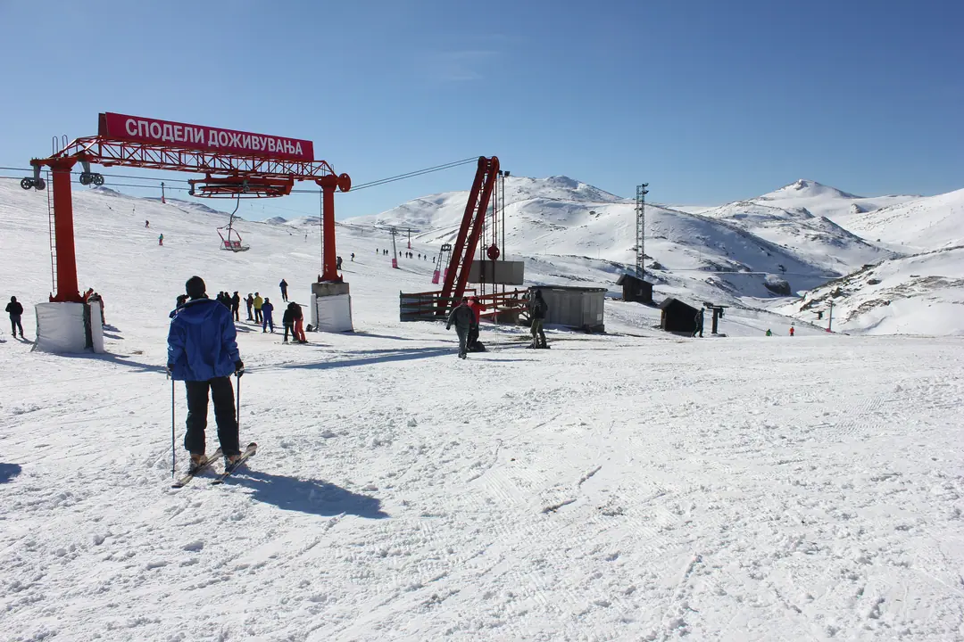 Skier at the base of the lifts in Mavrovo